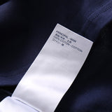 Flat lay presentation of Louis Vuitton cotton t-shirt with monogram-inspired silhouette