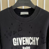 Close-up detail shot of Givenchy luxury clothing with logo-detail design