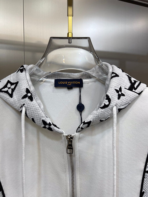 Close-up detail shot of Louis Vuitton luxury clothing with label-forward styling