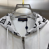 Close-up detail shot of Louis Vuitton luxury clothing with label-forward styling