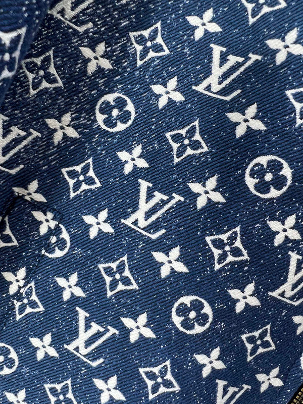 Flat lay presentation of Louis Vuitton luxury clothing with label-forward styling