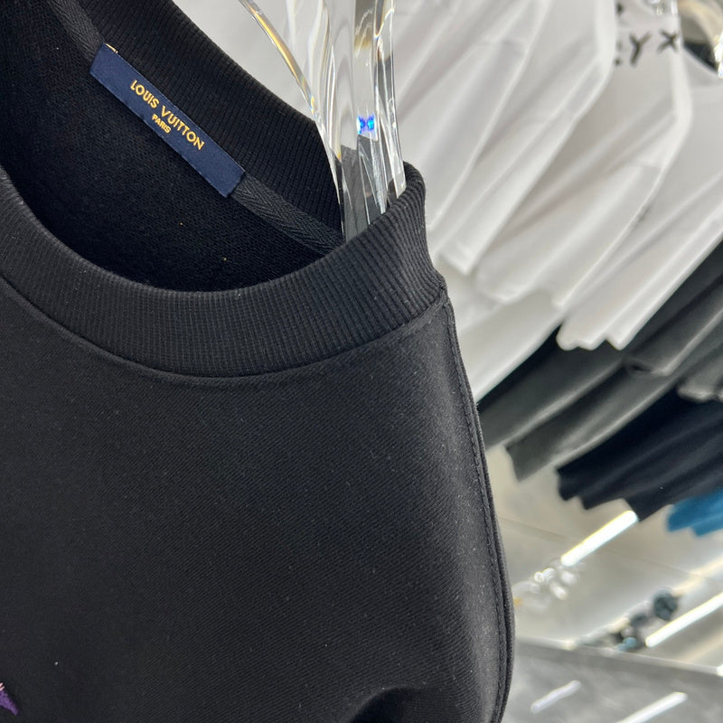Flat lay presentation of Louis Vuitton luxury clothing with relaxed-fit cut