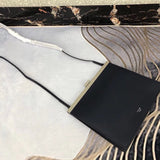 Styled lifestyle shot of everyday-luxe sleek women's handbag – women's everyday handbag
