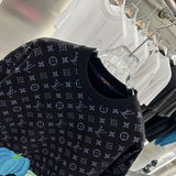 Full styled look of Louis Vuitton luxury clothing with tailored silhouette