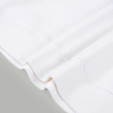 Flat lay presentation of Louis Vuitton luxury clothing with tailored silhouette