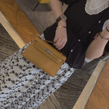 Side view of streamlined structured handbag
