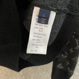 Close-up detail shot of Louis Vuitton luxury clothing with label-forward styling