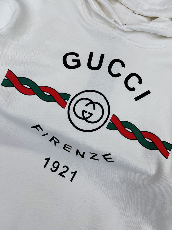 Close-up detail shot of Gucci luxury clothing with logo-detail design