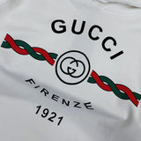 Close-up detail shot of Gucci luxury clothing with logo-detail design