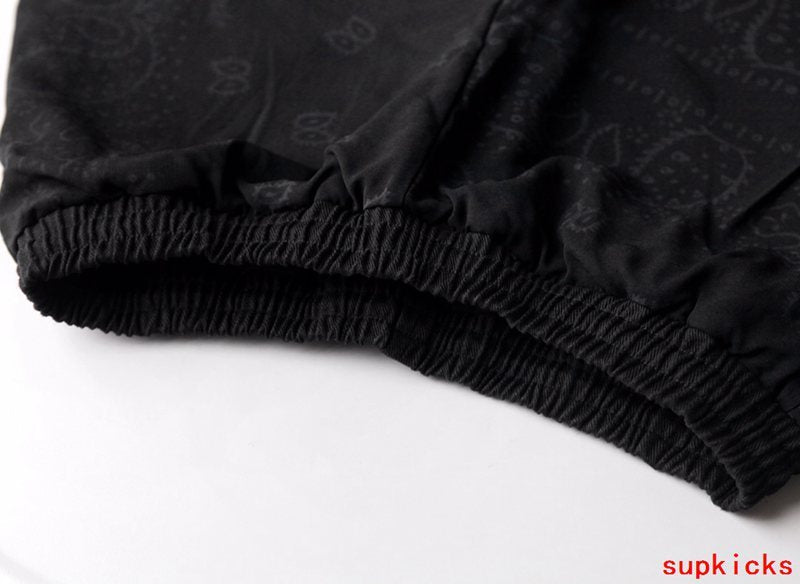 Flat lay presentation of Rhude luxury clothing with everyday silhouette