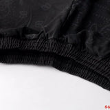 Flat lay presentation of Rhude luxury clothing with everyday silhouette