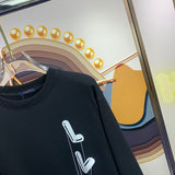 Full styled look of Louis Vuitton luxury clothing with signature branding