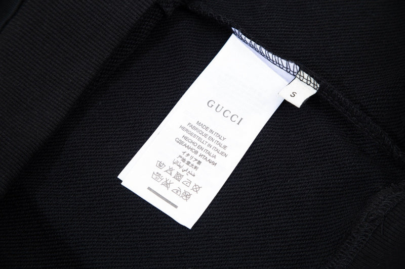 Close-up detail shot of Gucci luxury clothing with tailored silhouette
