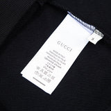 Close-up detail shot of Gucci luxury clothing with tailored silhouette