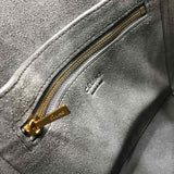 Styled lifestyle shot of elevated signature women's handbag – women's statement bag