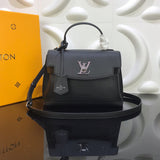 Side profile of polished signature women's handbag – women's designer-style accessory