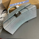 Styled lifestyle shot of classic refined women's handbag – women's luxury handbag
