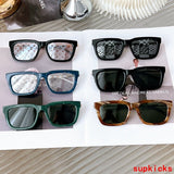 Close-up detail view of Louis Vuitton unisex sunglasses