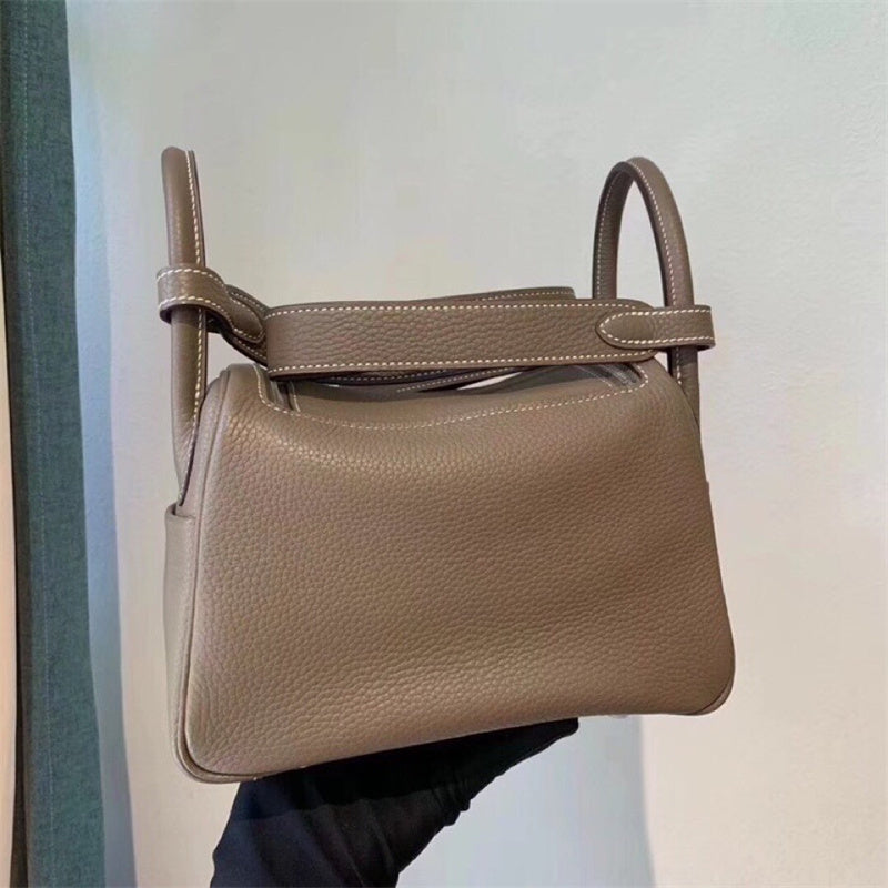 Side view of modern structured handbag