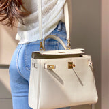 Side view of tailored structured handbag