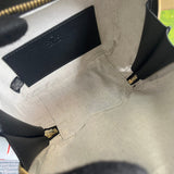 Back view of statement polished women's handbag – women's luxury accessory