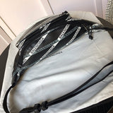 Front view of classic sleek women's handbag – women's luxury accessory