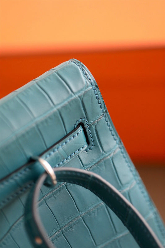 Side view of sculpted structured handbag