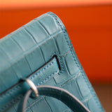 Side view of sculpted structured handbag