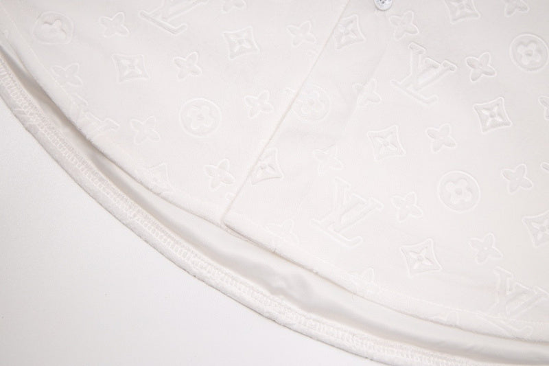 Close-up detail shot of Louis Vuitton luxury clothing with logo-detail design
