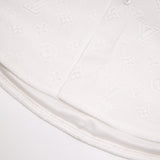 Close-up detail shot of Louis Vuitton luxury clothing with logo-detail design