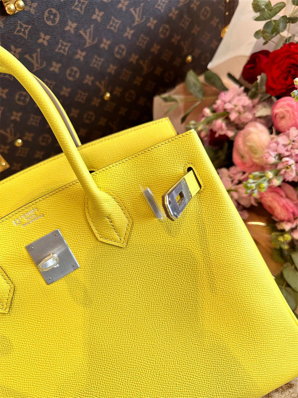 Side view of graceful structured handbag