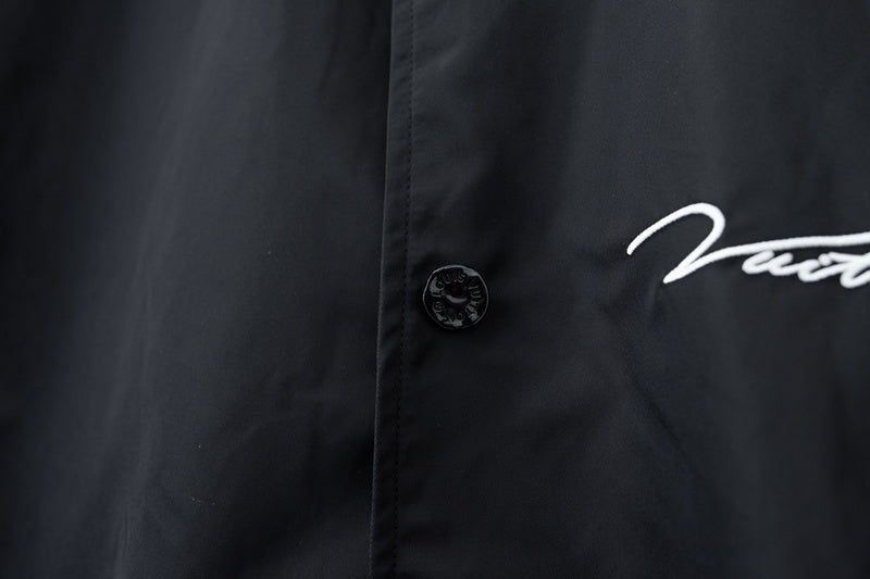 Flat lay presentation of Louis Vuitton luxury clothing with relaxed-fit cut