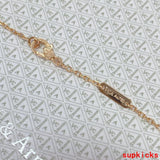 Lifestyle view of Van Cleef & Arpels unisex jewelry piece
