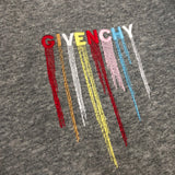 Flat lay presentation of Givenchy luxury clothing with contemporary cut