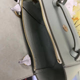 Front view of refined modern women's handbag – women's statement bag