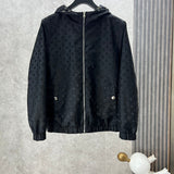 Close-up detail shot of Louis Vuitton luxury clothing with label-forward styling