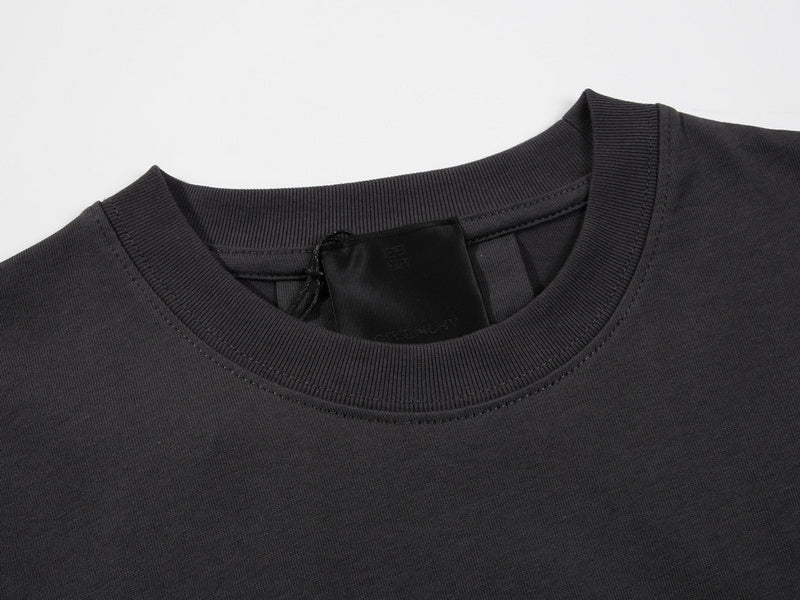 Close-up detail shot of Givenchy luxury clothing with signature branding