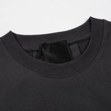 Close-up detail shot of Givenchy luxury clothing with signature branding