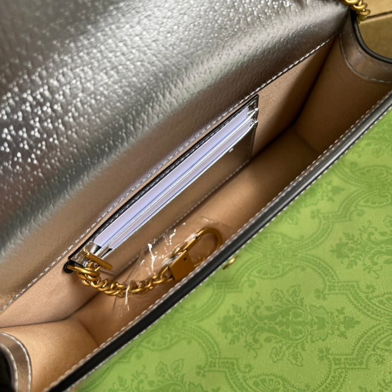 Front view of sleek polished women's handbag – women's designer-style accessory