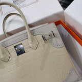Side view of understated structured handbag
