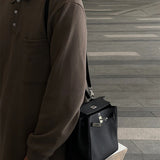  Structured top-handle bag carried on shoulder 10
