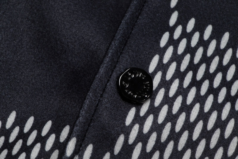 Close-up detail shot of Louis Vuitton luxury clothing with signature branding