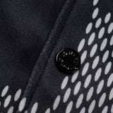 Close-up detail shot of Louis Vuitton luxury clothing with signature branding