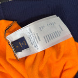 Front view of Louis Vuitton luxury clothing with label-forward styling