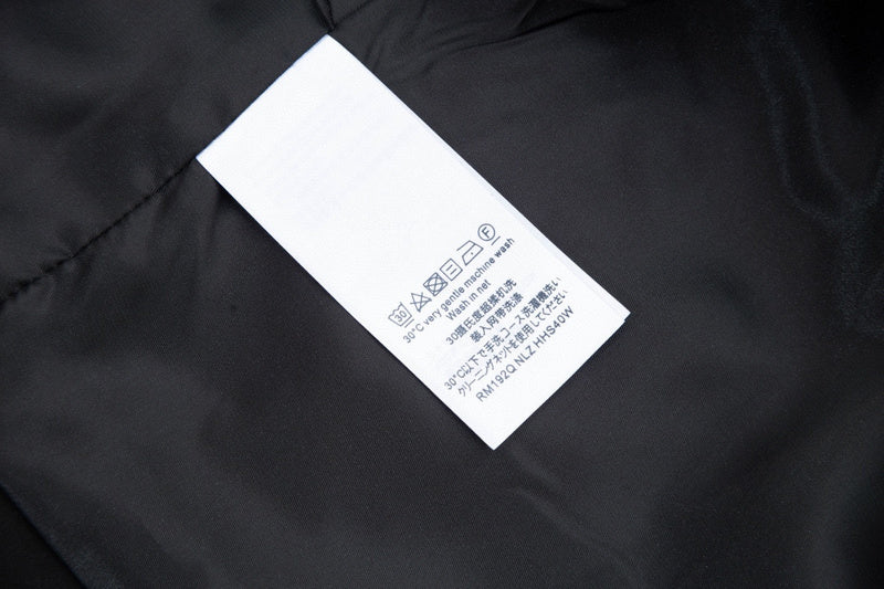 Close-up detail shot of Louis Vuitton luxury clothing with monogram-inspired silhouette