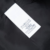 Close-up detail shot of Louis Vuitton luxury clothing with monogram-inspired silhouette