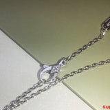 Side view of Van Cleef & Arpels unisex jewelry piece