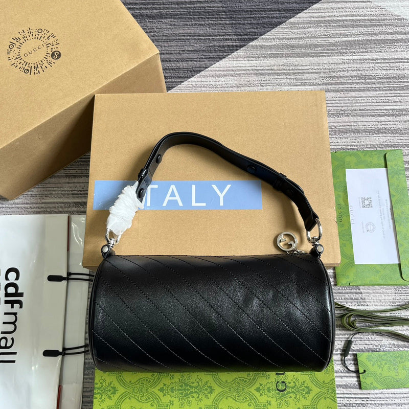 Front view of structured classic women's handbag – women's luxury accessory