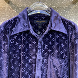 Flat lay presentation of Louis Vuitton luxury clothing with everyday silhouette