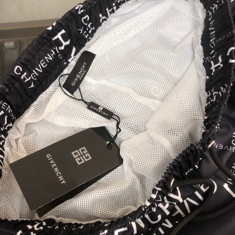 Flat lay presentation of Givenchy luxury clothing with signature branding